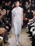 Model Walking in Proenza Schouler Fall Winter 2024 Runway Show Wearing Maude Dress in Cloud Technical Lace and Tee Over the Knee Boots in Stone Viscose Knit