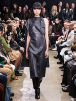 Image of model walking Proenza Schouler Fall Winter 2024 Runway wearing Maude Dress in Leather in slate