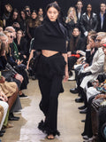 Image of model walking Proenza Schouler Fall Winter 2024 Runway wearing Shawl in Textured Knits in black