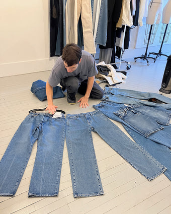 Image of creative director Lazaro Hernandez examining denim options