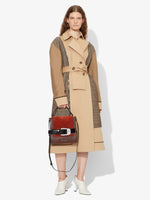 Image of model wearing Buckle Trapeze Bag in Grainy Calf and Suede in Russet