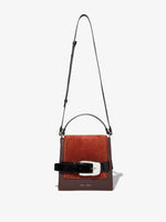 Front  image of Buckle Trapeze Bag in Grainy Calf and Suede in Russet with strap extended