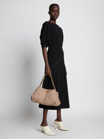 Image of model wearing Nappa Tobo Shoulder Bag in LIGHT TAUPE