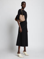 Image of model wearing Nappa Tobo Shoulder Bag in LIGHT TAUPE