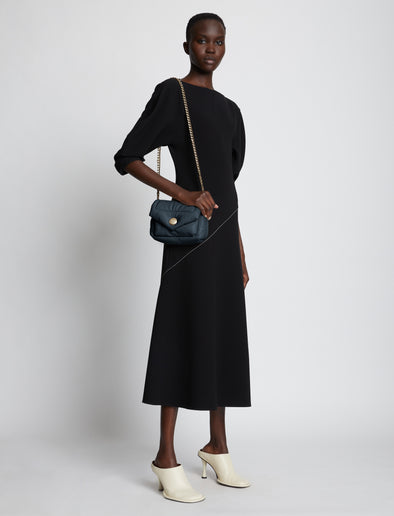 Image of model carrying Small PS Harris Bag in dark navy