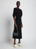 Image of model carrying Small PS Harris Bag in dark navy