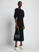 Image of model carrying Small PS Harris Bag in dark navy