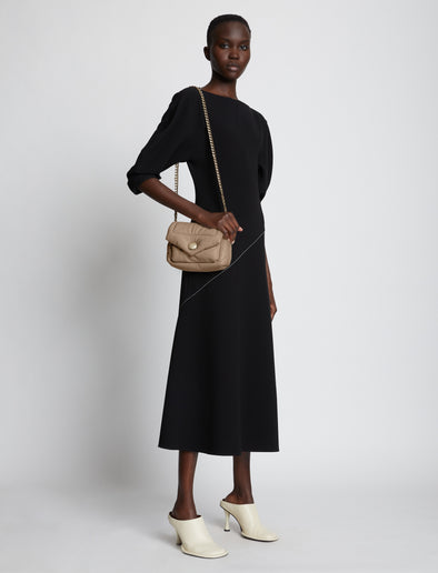 Image of model carrying Small PS Harris Bag in light taupe