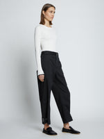 Side full length image of model wearing Cotton Twill Tapered Pants in BLACK