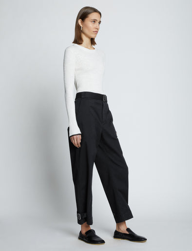 Side full length image of model wearing Cotton Twill Tapered Pants in BLACK