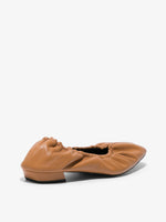 Back 3/4  image of lamb ruched ballet flat in medium orange