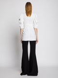 Back full length image of model wearing Linen Viscose Shirred Sleeve Top in OFF WHITE