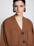 Detail image of model wearing Eco Cashmere Cardigan in SADDLE