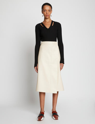 Front image of model wearing Faux Leather Wrap Skirt in cream