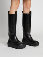 On model image of Storm Boots in black