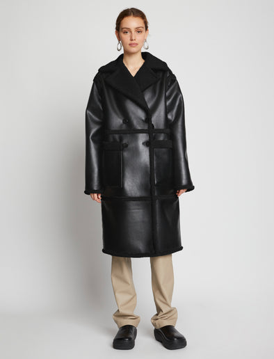 Front image of model wearing Faux Sherpa Coat in black