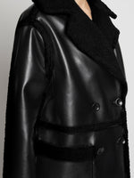 Detail image of model wearing Faux Sherpa Coat in black