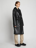 Side image of model wearing Faux Sherpa Coat in black