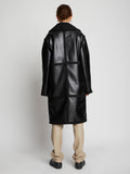 Back image of model wearing Faux Sherpa Coat in black