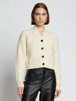 Cropped front image of model wearing Cashmere Merino Cardigan in cream