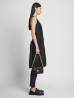 Image of model carrying Small Rafia PS Harris Bag in black