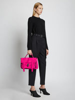 Image of model wearing PS1 Medium Bag in FUSCHIA