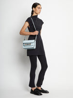 Image of model wearing PS11 Mini Classic Bag in PALE BLUE