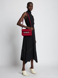 Image of model wearing PS11 Mini Classic Bag in BORDEAUX