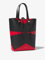 Side image of Pieced North South Tobo Tote in bright red/black