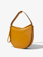 Side image of Baxter Leather Bag in GOLDENROD