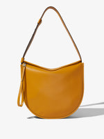 Front image of Baxter Leather Bag in GOLDENROD with strap extended