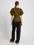 Back full length image of model wearing Plaid Poplin Puff Sleeve Top in OLIVE/BLACK