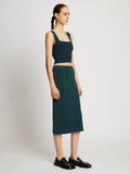 Side full length image of model wearing Melange Knit Midi Skirt in BLACK/DUSTY BLUE