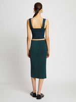 Back full length image of model wearing Melange Knit Midi Skirt in BLACK/DUSTY BLUE