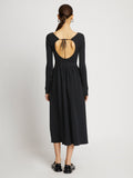 Back full length image of model wearing Rib Knit Long Sleeve Dress in BLACK