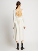 Back full length image of model wearing Rib Knit Long Sleeve Dress in OFF WHITE