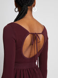 Detail image of model wearing Rib Knit Long Sleeve Dress in PLUM