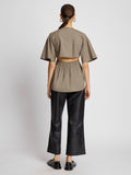 Back full length image of model wearing Poplin Drawstring Blouse in TAUPE