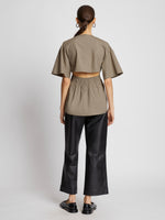 Back full length image of model wearing Poplin Drawstring Blouse in TAUPE