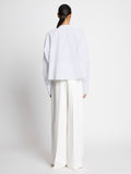 Back full length image of model wearing Eco Poplin Blouse in WHITE