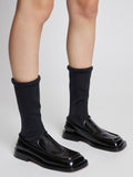 Image of model wearing SQUARE LOAFER STRETCH BOOT in Black