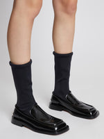 Image of model wearing SQUARE LOAFER STRETCH BOOT in Black