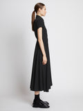 Side full length image of model wearing Lightweight Crepe Buttoned Dress in BLACK