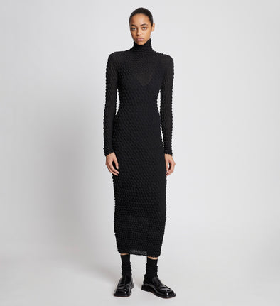 Front full length image of model wearing Shibori Turtleneck Dress in BLACK