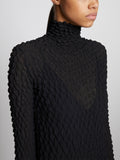 Detail image of model wearing Shibori Turtleneck Dress in BLACK