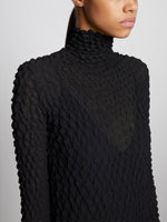 Detail image of model wearing Shibori Turtleneck Dress in BLACK