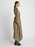 Side full length image of model wearing Printed Leopard Crepe Belted Dress in BUTTER MULTI