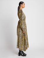 Side full length image of model wearing Printed Leopard Crepe Belted Dress in BUTTER MULTI