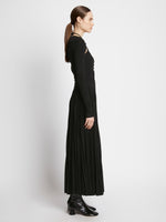 Side full length image of model wearing Pleated Matte Jersey Halter Dress in BLACK