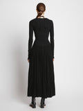 Back full length image of model wearing Pleated Matte Jersey Halter Dress in BLACK